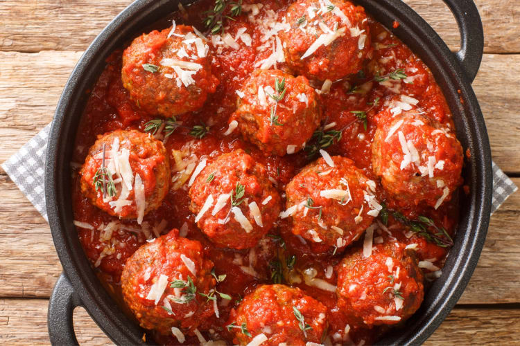 A dish with meatballs in tomato sauce