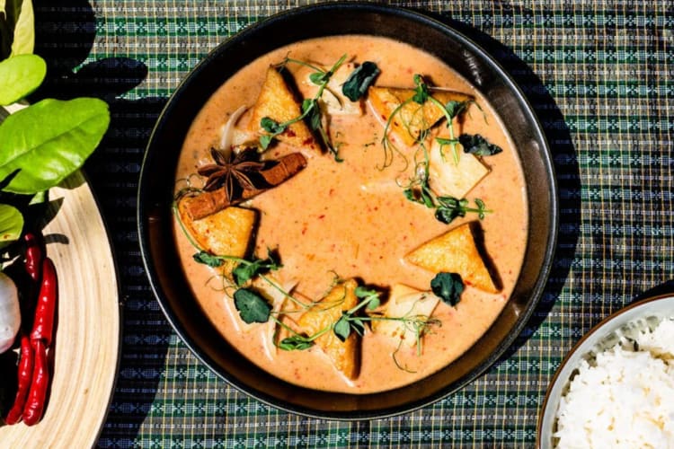 A yellow curry in a bowl