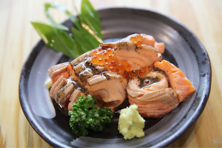 an elaborate salmon dish with salmon roe