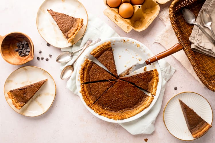 A chocolate flan with slices cut out