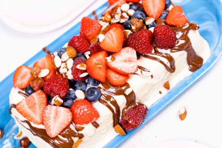 A semifreddo with berries and chocolate sauce