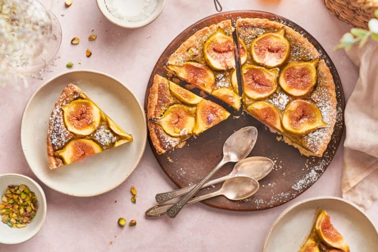 A fig tart cut into slices 
