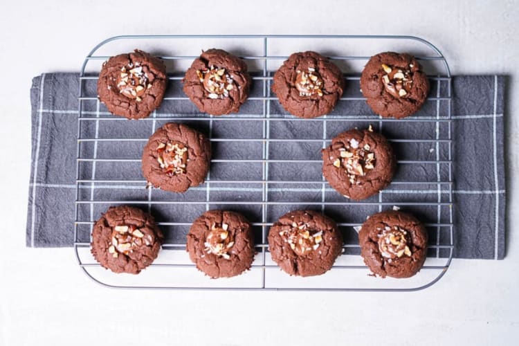 Aerial view of 10 nutella cookies on a steel oven grid