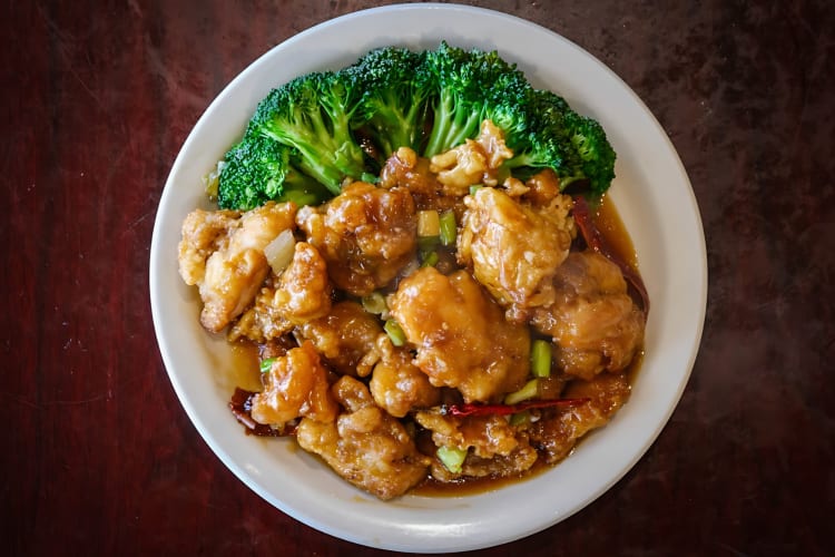 General Tso's chicken served with broccoli