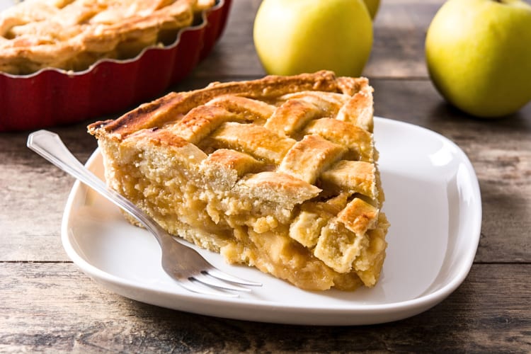 Slice of apple pie on a plate with a fork as breakfast in Tucson