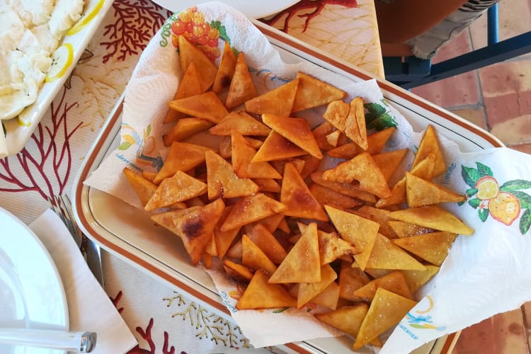 Aerial view of panelle in a large serving dish