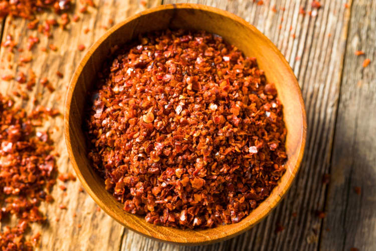 A wooden bowl with chile pepper powder