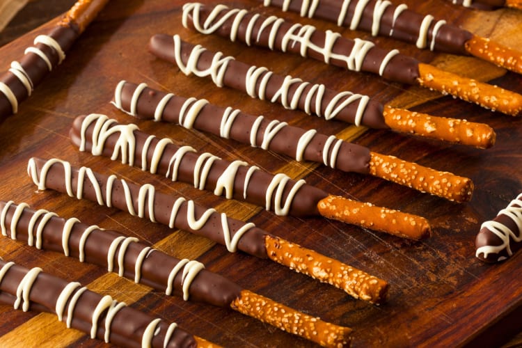 Pretzel sticks with milk chocolate and a white chocolate drizzle