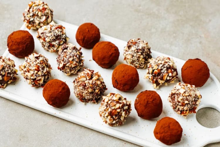 Dark chocolate truffles on a board