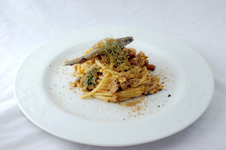 Pasta con le sarde on a white plate