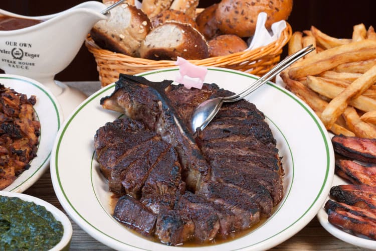 Variety of meats, rolls, fries and gravy from Peter Luger Steak House