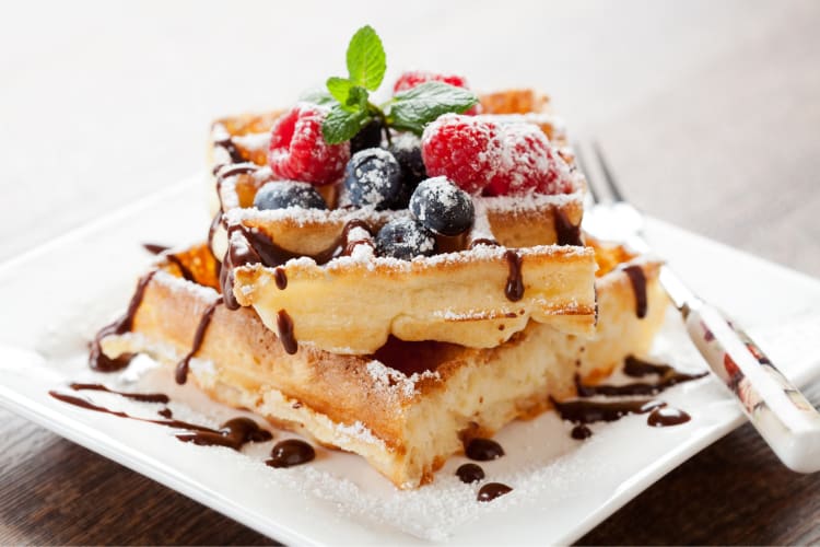 Waffles with fruit and chocolate sauce