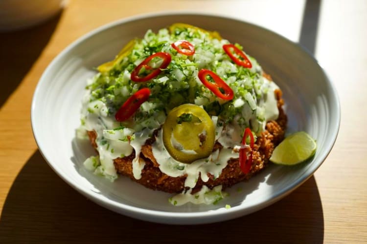 Fried chicken with lettuce, sour cream, green onions and jalapeno