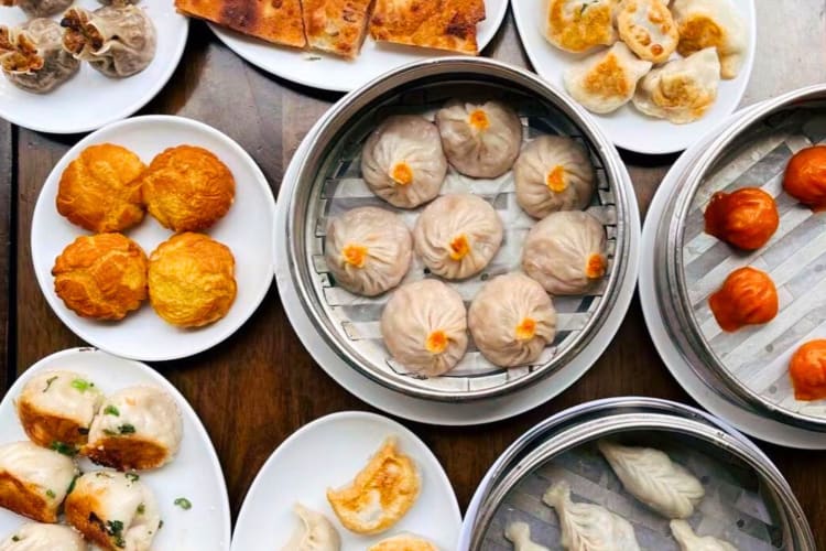 An aerial view of dumpling dishes on a table