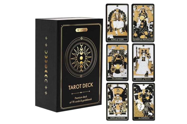 A black box with gold writing next to six tarot cards