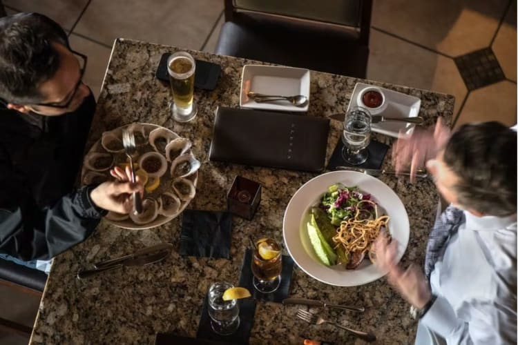 Two people enjoying dinner in a Pittsburgh restaurant.