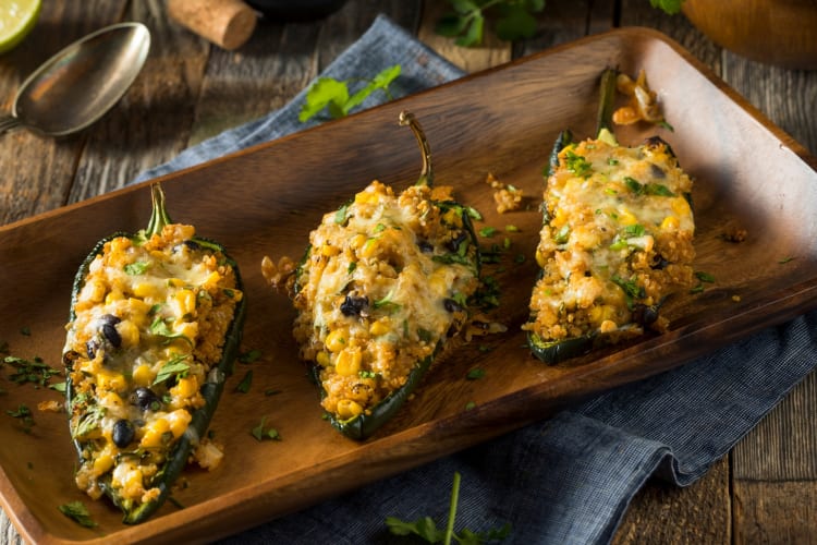 Stuffed poblano peppers on a tray