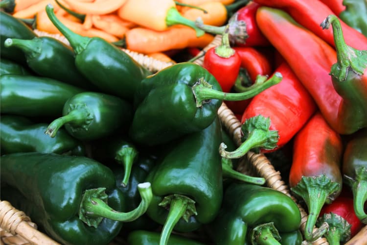 Different kinds of peppers in baskets