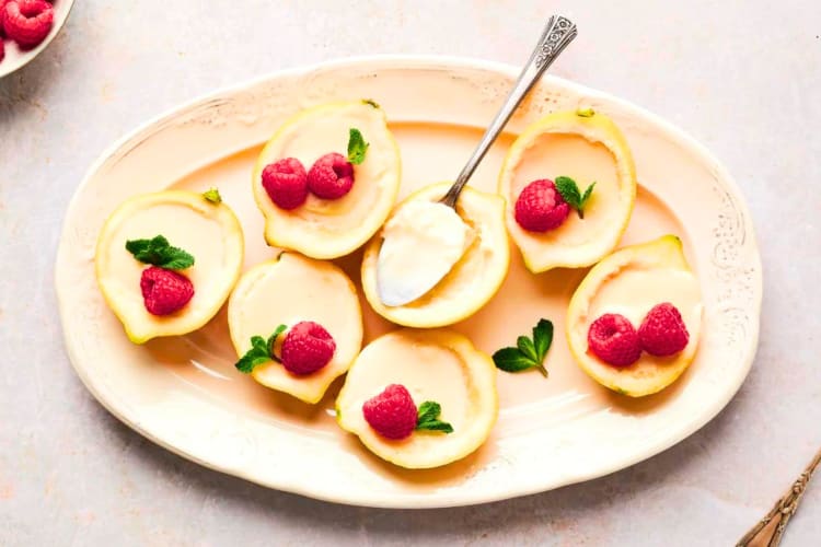 Lemon pudding dessert served in hollowed-out lemons