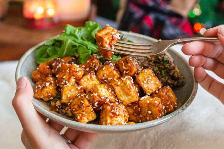 A bowl of marinated tofu with sesame seeds