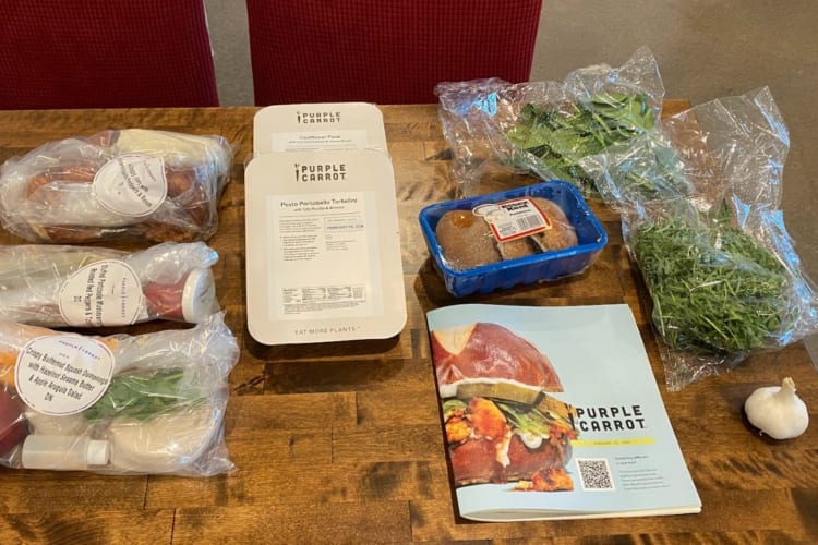 Groceries and a booklet on a table