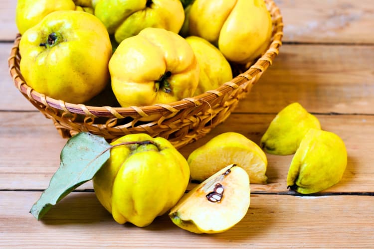 Quince in and around a basket