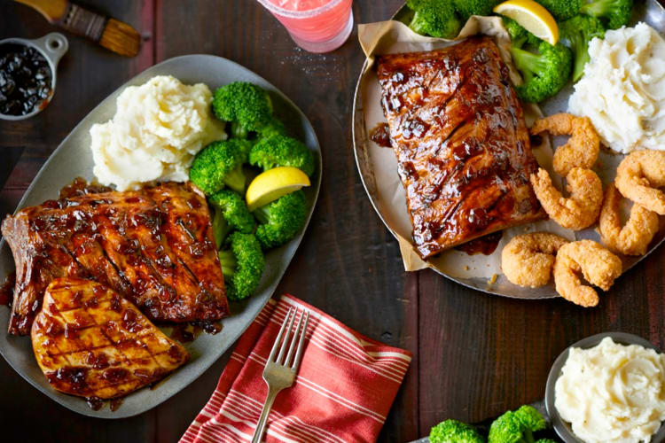 Dishes with steak, broccoli and mashed potatoes