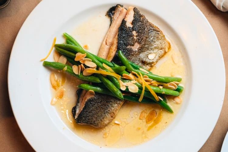 Trout paired with crisp green beans, toasted almonds and preserved lemon