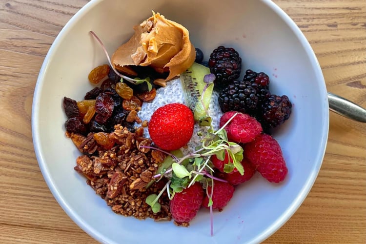 Chia bowl topped with an assortment of fruit and peanut butter from Rize, a diner in Indianapolis