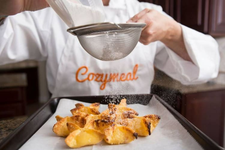 A private chef prepares a dish.