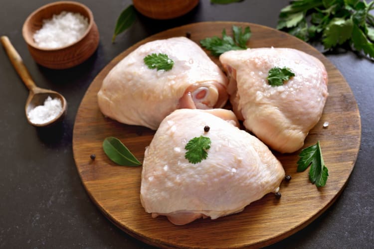 raw chicken thighs prepared for cooking