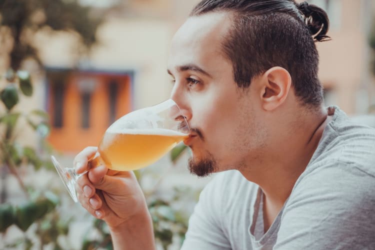 man drinking a beer