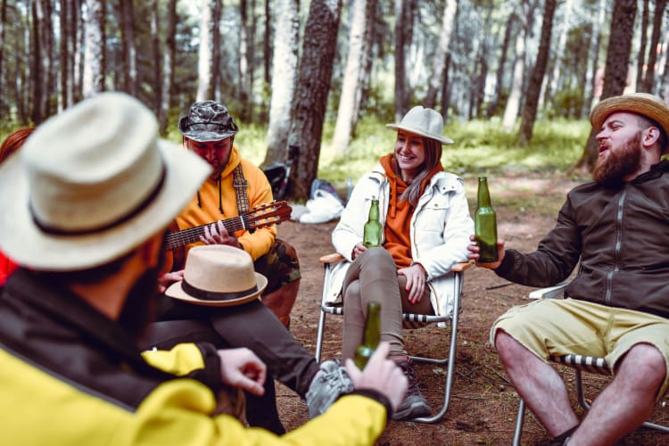 friends drinking beer and singing outside