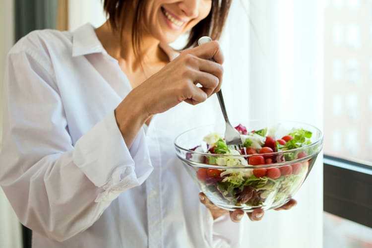 woman eating salad