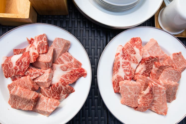 two plates of Matsusaka beef ready for barbecuing