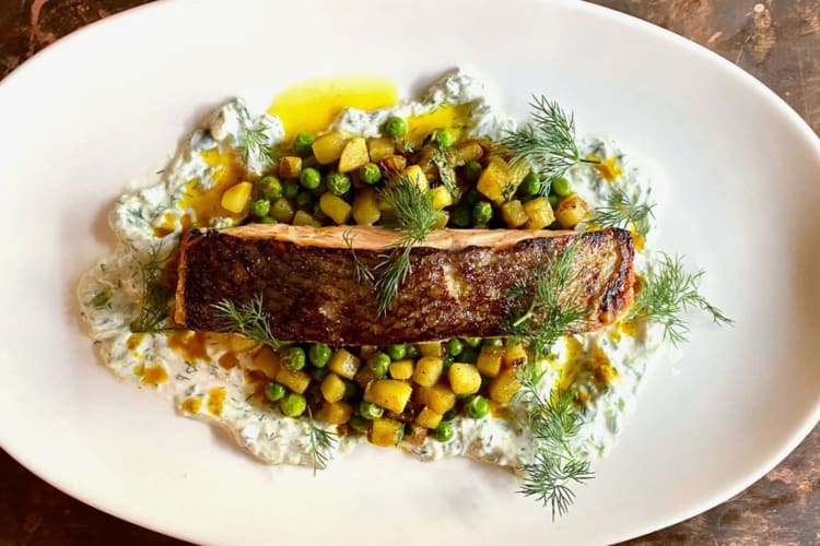 grilled salmon with tzatziki, peas and potatoes