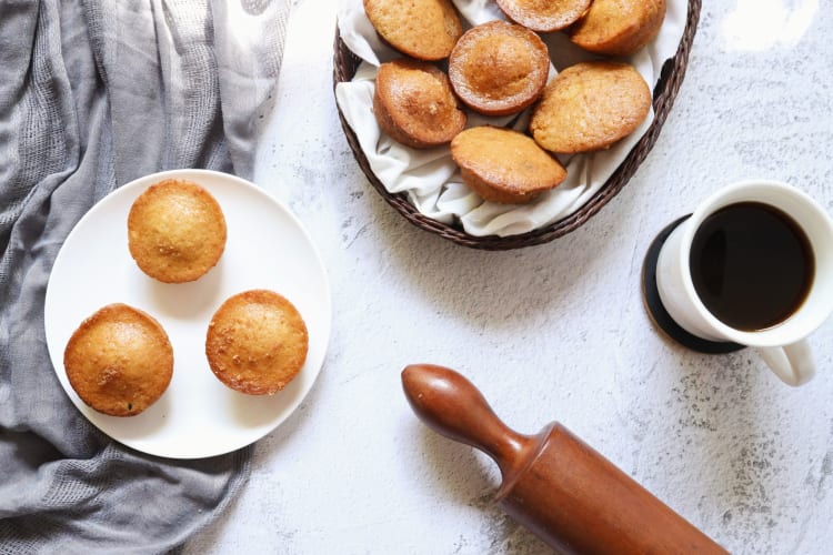 Aerial view of a cup of coffee, a rolling pin and Kababayans, a famous Filipino food