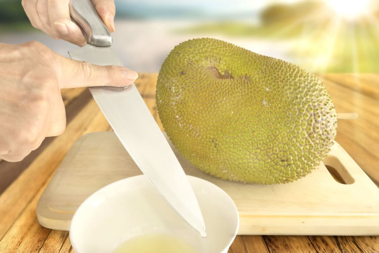 oiling knife before cutting jackfruit