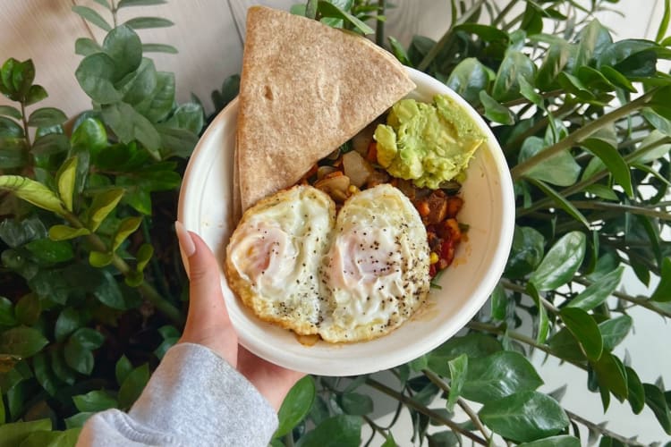 woman holding a healthy egg breakfast