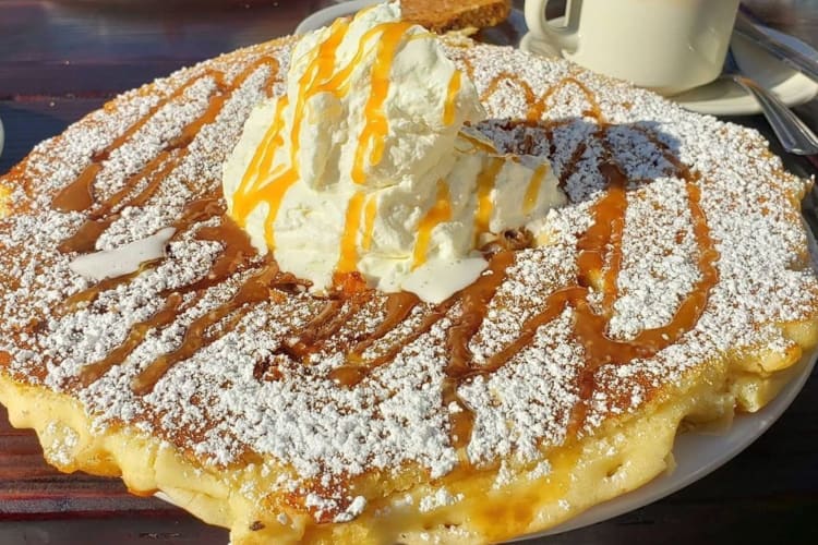 pancakes with whipped cream on top