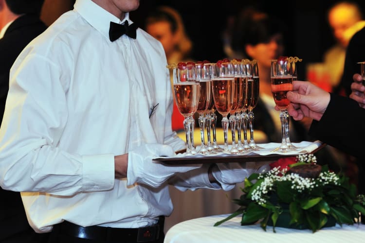 waiter serving Champagne