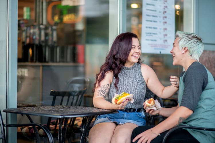 couple eating hot dog