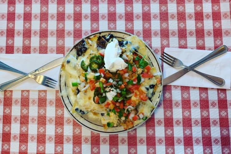 nachos on a red checkered tablecloth