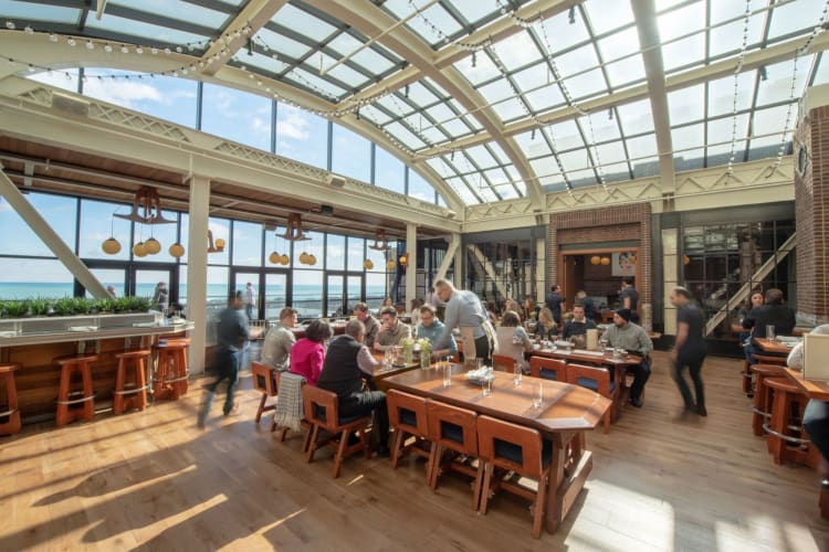 the wide, bright dining area of Cindy's Rooftop