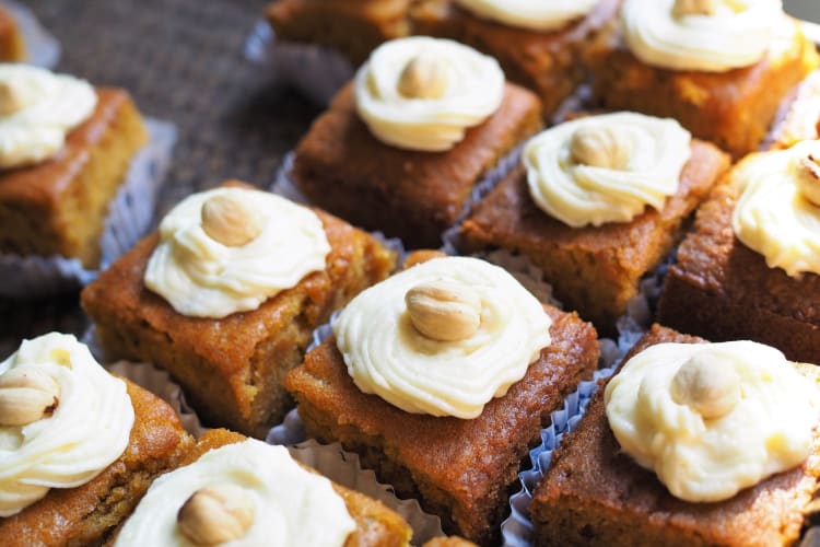 a group of pumpkin squares with cream cheese frosting