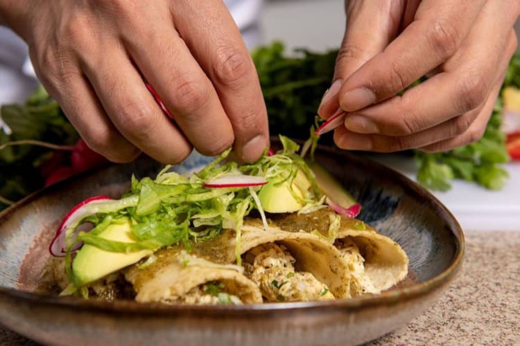 chef preparing enchiladas