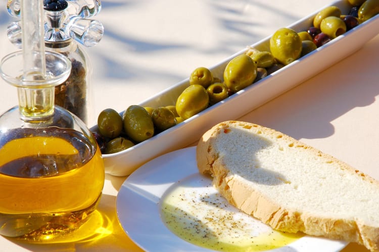 extra virgin olive oil with olives and bread