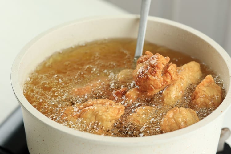 chicken karaage being deep fried 