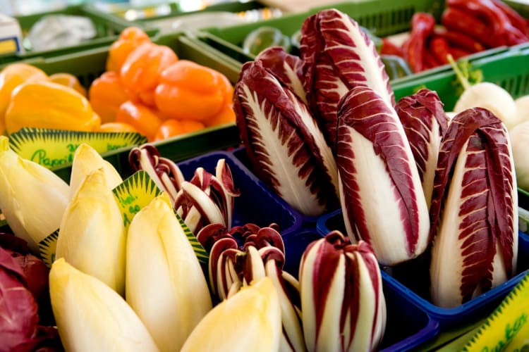 red and Belgian endives in a produce section