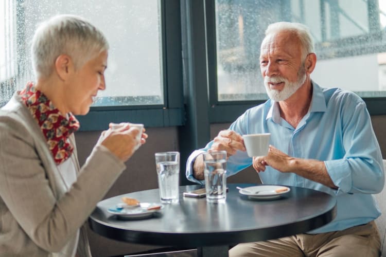 Healthy senior couple drinking coffee in a coffee shop